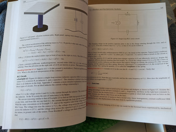 Photograph of p. 128-129 of physical book to show print quality